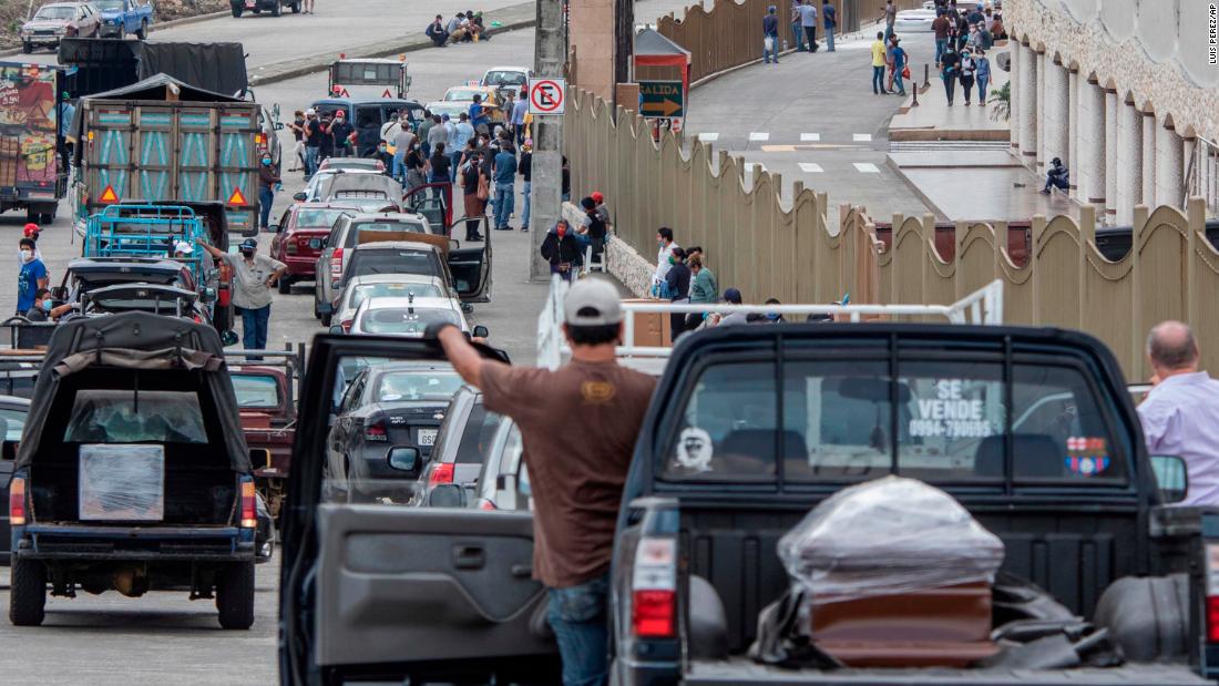 People wait in line to bury loved ones at a cemetery in Guayaquil, Ecuador, on April 6. In some parts of the &lt;a href=&quot;https://edition.cnn.com/2020/04/03/americas/guayaquil-ecuador-overwhelmed-coronavirus-intl/index.html&quot; target=&quot;_blank&quot;&gt;overwhelmed city,&lt;/a&gt; bodies have been left on the streets. 